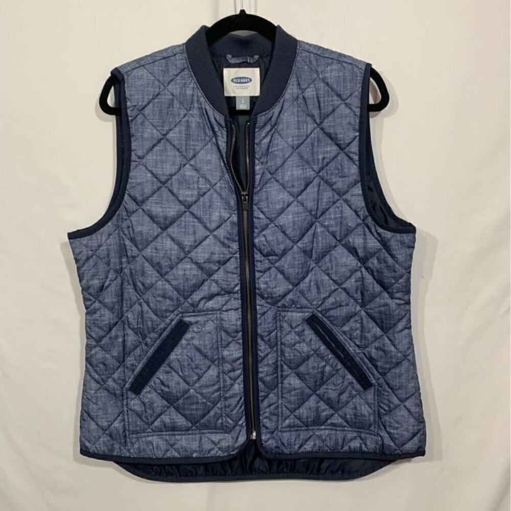 Woman’s quilted blue vest. Size large. New condition. Full zip, pockets.